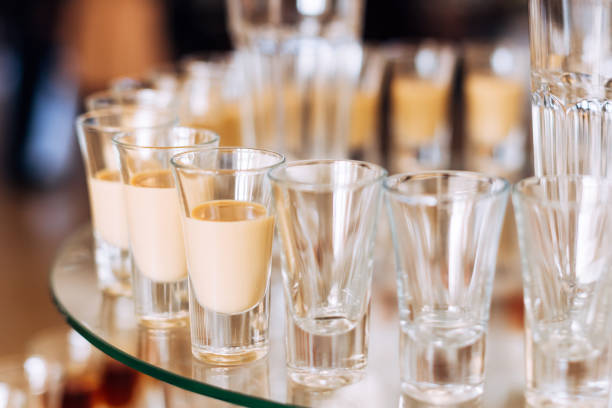 istock glasses with alcoholic beverages on a transparent stand. wedding 1453634214