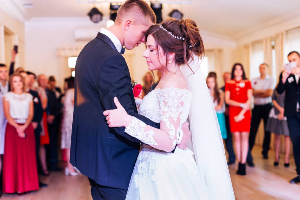 istock Beautiful wedding couple just married and dancing their first da 1453634245