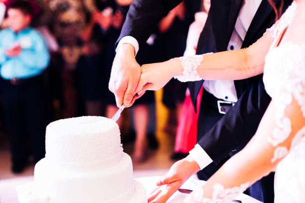 istock A bride and a groom is cutting their wedding cake. wedding. rest 1453634255