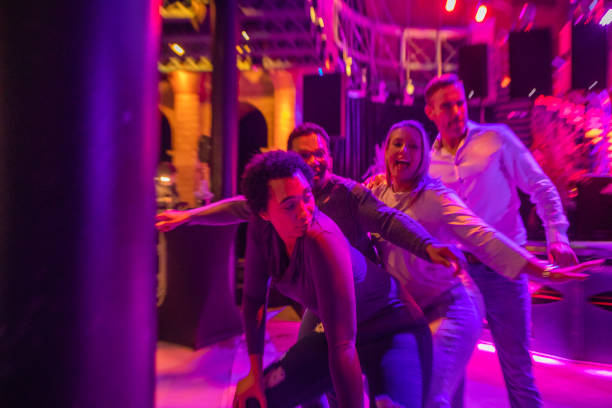 istock Four friends at a New Year's Eve Party Celebration 1453636558