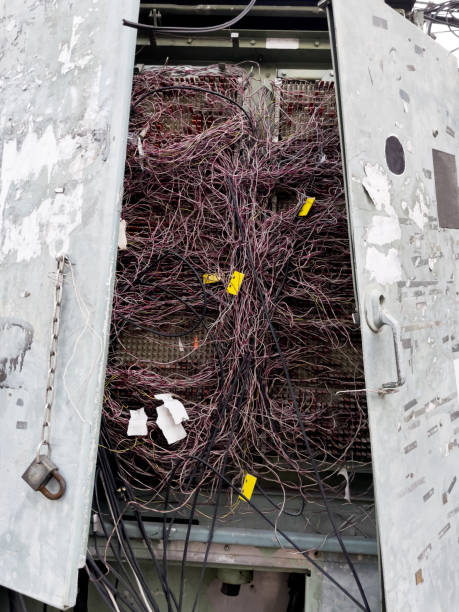 istock Damaged public placed cabinet of telecommunications wires 1453636610