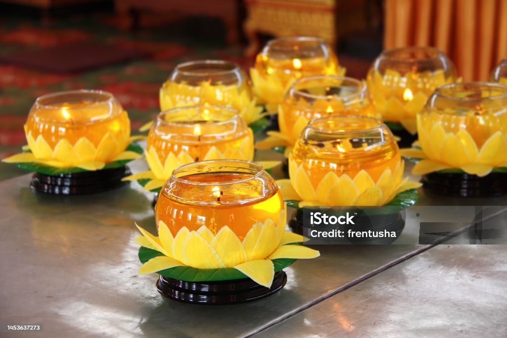 Burning candles in glass candlesticks in the form of a lotus, buddhist temple, Penang island, Malaysia Burning candles in glass candlesticks in the form of a lotus in buddhist temple, Penang island, Malaysia Backgrounds Stock Photo