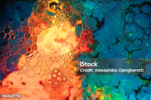 istock Oil and soap bubbles on water, abstract background 1453637754