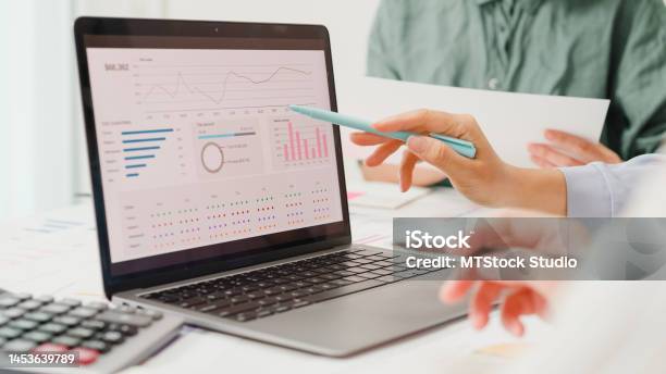 Closeup Group Of Asian Business People Meeting Discuss Project Plan And Financial Results In Office Stock Photo - Download Image Now