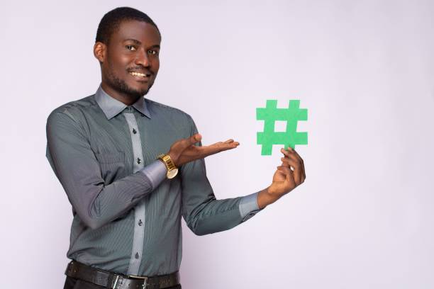 istock businessman holding a hash tag symbol 1453646537