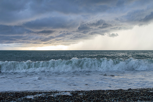 storm at sea waves clouds rain wind. photo