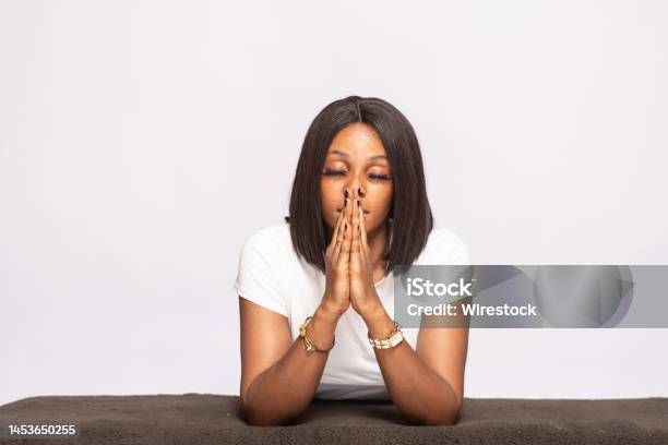 African Lady Saying Her Prayers Stock Photo - Download Image Now - Praying, Women, Adult