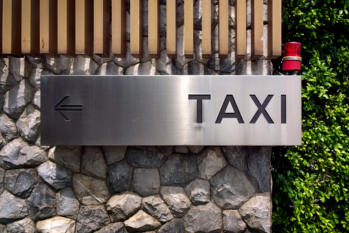 Taxi sign on Building exterior