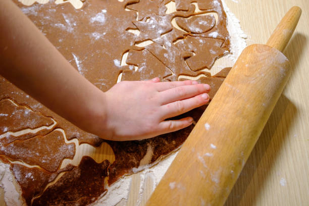istock A child is making Christmas cookies. Culinary concept. Children 1453651599