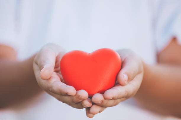istock little boy holding heart 1453651713
