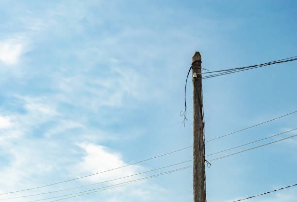 istock Power electric pole with line wire on colored background close up 1453651799