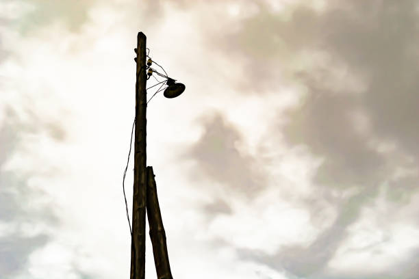 Power electric pole with line wire on colored background close up, photography consisting of power electric pole with line wire under sky, line wire in power electric pole for residential buildings