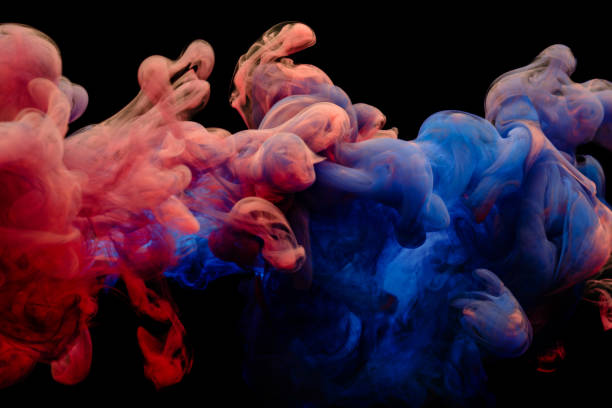 istock Colorful ink swirling in water 1453653422