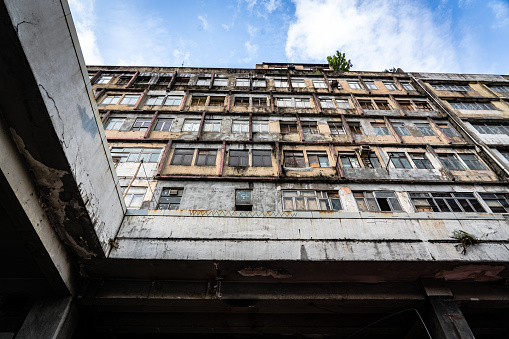 A street of long abandoned and derelict collapsing houses and commercial buildings