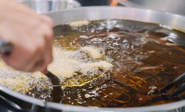 istock Preparation of fried churros with sugar typical of Spain 1453657671