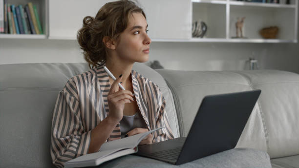 istock Manager watching online training in pajamas closeup. Weekend leisure at home 1453660096
