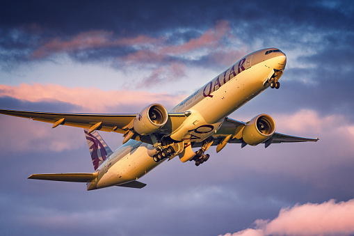 Qatar Airways Boeing 777 taking off from London Heathrow Airport during sunset.\n\nDate: May 25, 2022