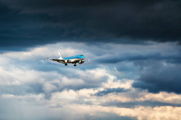KLM Embraer E190 on final approach into London City Airport against a sea of clouds.\n\nDate: May 24, 2022