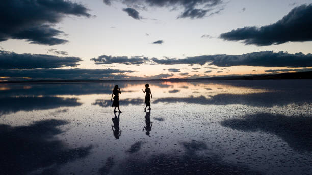 istock Young ballerinas dancing on the the sea sunset 1453661217