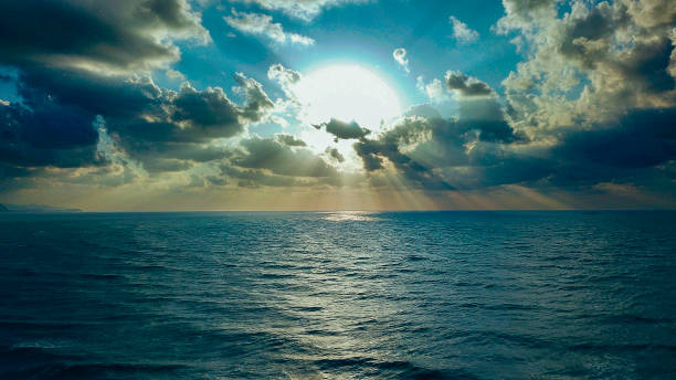 Scenic View Of Seascape Against Sky During Sunset