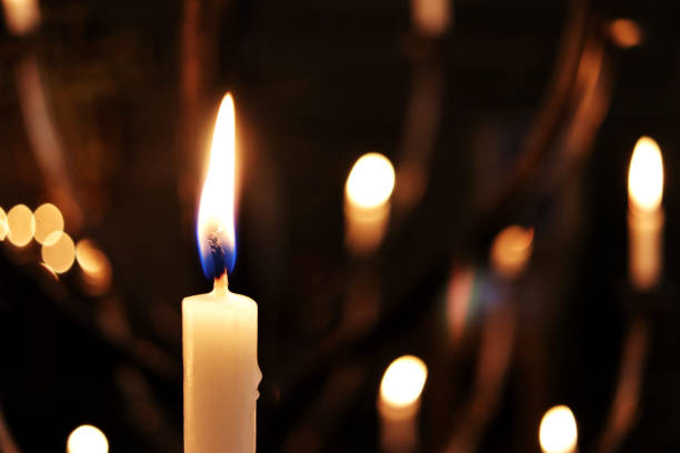 Candles of Remembrance - Anglican Cathedral Candles of remembrance lit in an Anglican Cathedral at Christmas time spirituality photography close up horizontal stock pictures, royalty-free photos & images