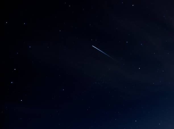 istock Closeup shot of a comet in a dark sky at night 1453665517