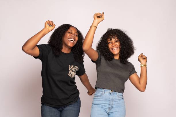 istock young african ladies rejoicing 1453666175