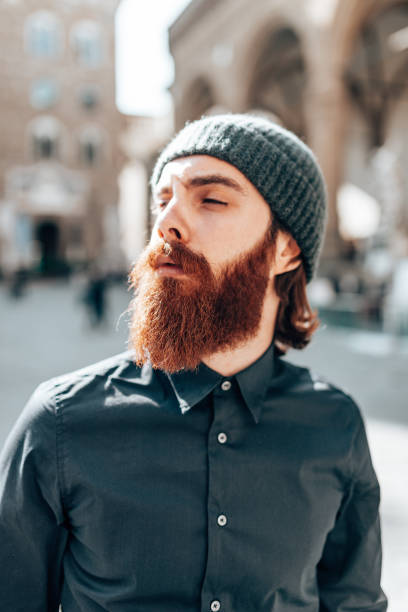 istock hipster portrait with long beard in Florence 1453666275