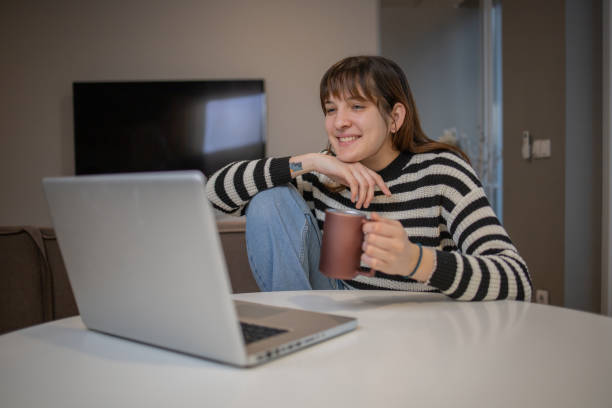 istock Young woman working from home 1453667300