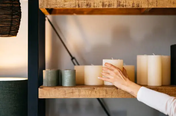 Photo of Close Up Photo Of Woman Hands Decorating Her Store