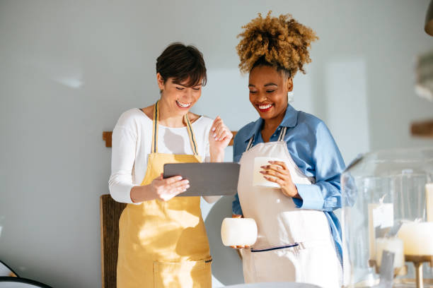 istock Two Happy Colleagues Working Together In A Home Decor Store 1453669106
