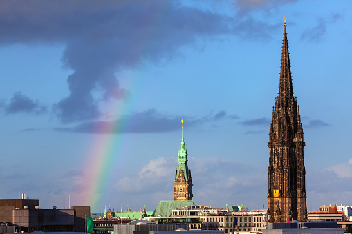 Rainbow over the cathedral . Rainbow in Hamburg city