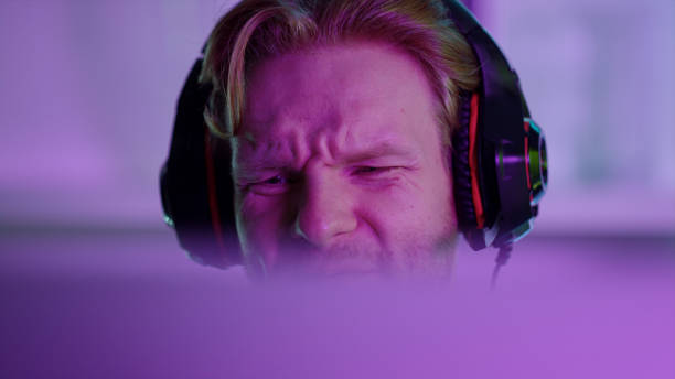 istock Upset man losing computer game closeup. Angry gamer shouting looking screen 1453669887