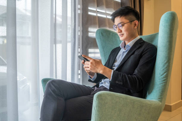 istock Businessman checking massage with smart phone 1453671404