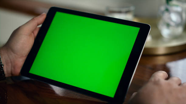 istock Closeup chroma key tablet in businessman hands. Manager hold mockup device 1453674151