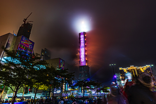 Taipei, Taiwan - 01/01/2023: Taipei 101 Tower LED display after new year fireworks viewed from Taipei City Government Plaza.