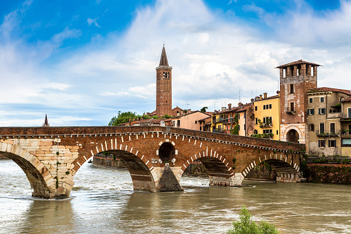 Adige River and bridge Ponte di Pietra in Verona in a beautiful summer day, Italy