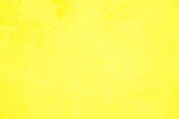 istock Concrete wall yellow color for texture background. Abstract grunge bright colorful color background with growing effect. Pastel yellow colored low contrast textured with roughness and irregularities. 1453676896