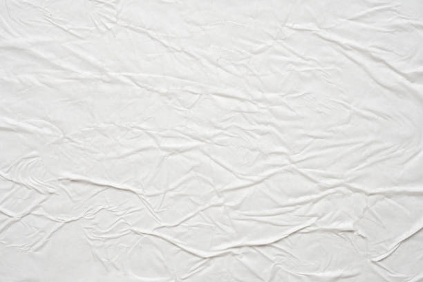 istock white crumpled and creased paper poster texture background 1453676923