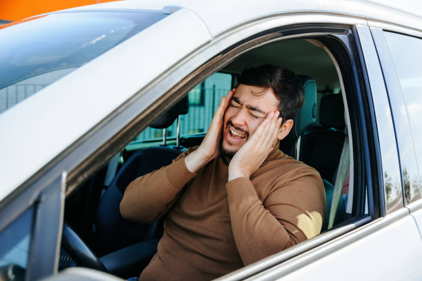 istock Tired mature driver hand on head waiting in traffic and contemplating about job problems 1453676944
