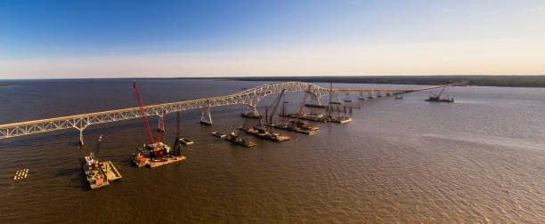 Aerial view of the reconstruction of the Governor Harry W. Nice Memorial/Senator Thomas “Mac” Middleton Bridge connected Virginia and Maryland, with multiple floating cranes vessels along with the construction site on the Potomac River. Aerial view of construction on the Potomac River, near Governor Harry W. Nice Memorial/Senator Thomas “Mac” Middleton Bridge connected Virginia and Maryland, USA.  Extra-large,high-resolution stitched panorama. maryland us state photos stock pictures, royalty-free photos & images