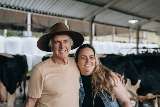 istock Farmer father and daughter hugging 1453683088