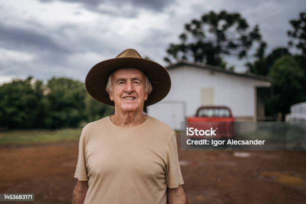 Senior Farmer On His Property Stock Photo - Download Image Now - 70-79 Years, Active Seniors, Adult