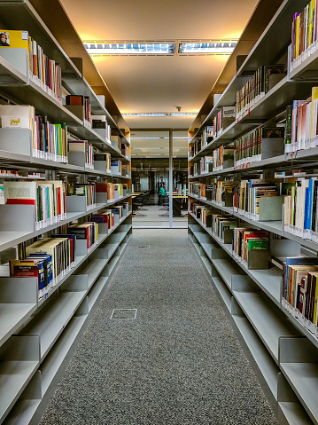 Bookcases on the aisle of the library in the University of Fujian Province, China