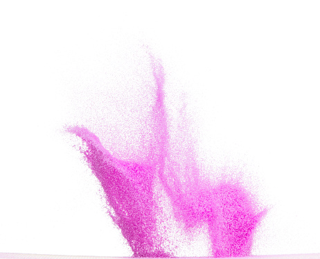 Small size purple Sand flying explosion, violet sands grain wave explode. Abstract cloud fly. purple colored sand splash throwing in Air. White background Isolated high speed shutter, throwing freeze
