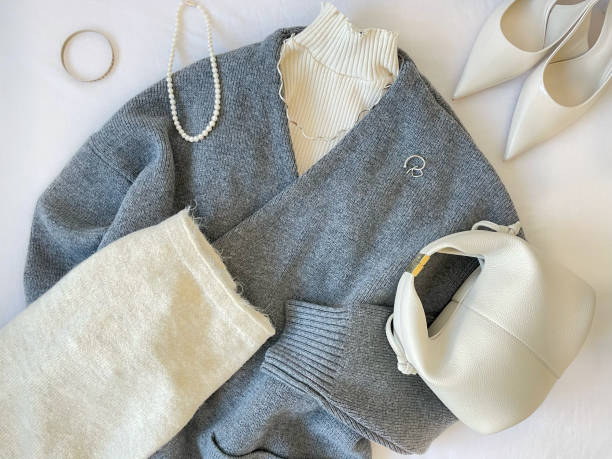 istock Gray cardigan knit coat and white items 1453685656