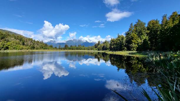 istock Reflection pool reflecting mirror views of snowcapped Mount Cook and Mount Tasman 1453687411