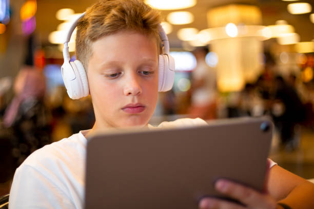 istock Teenage boy drawing on ipad. 1453691132