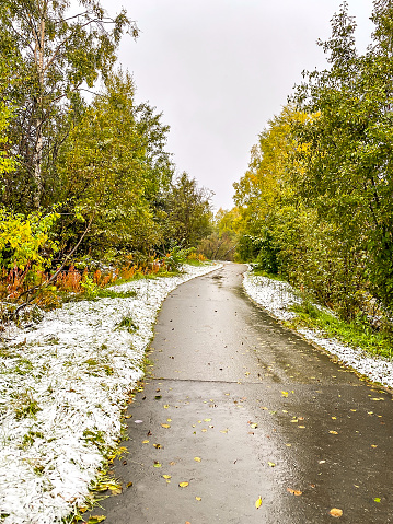 Ship Creek, located in Anchorage, Alaska offers a peaceful walkway for all. The early snow adds to the beauty of the wet terrain.