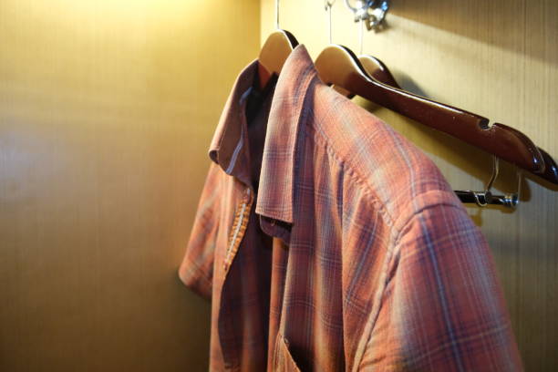 istock Flannel shirt left hanged inside wardrobe 1453702680